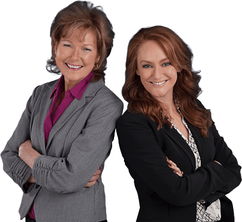 Two professional women smiling, representing asset and care management services.